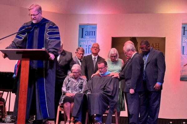 Praying over Dr. Best and his wife Terri