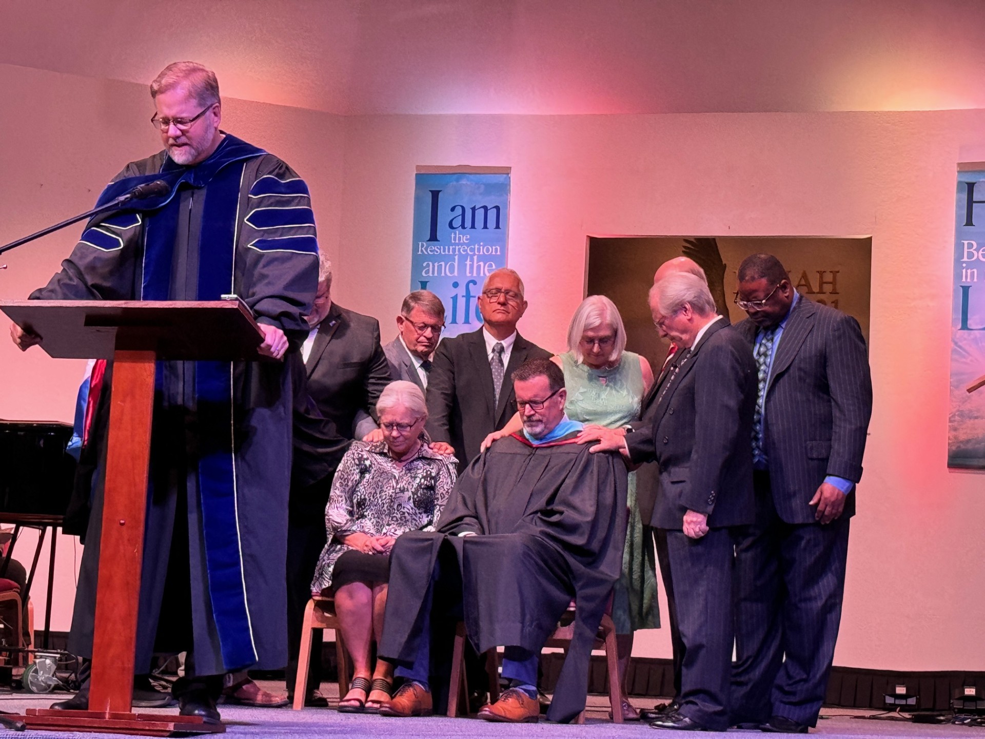 Praying over Dr. Best and his wife Terri